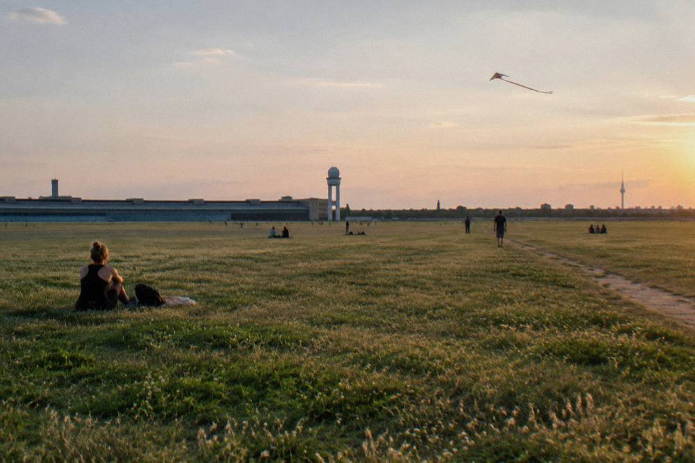 An open former airfield with wide grassy expanses under a wide sky