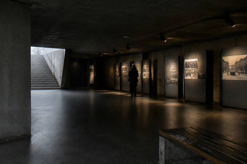 Interior exhibition hall with informational displays and dim lighting