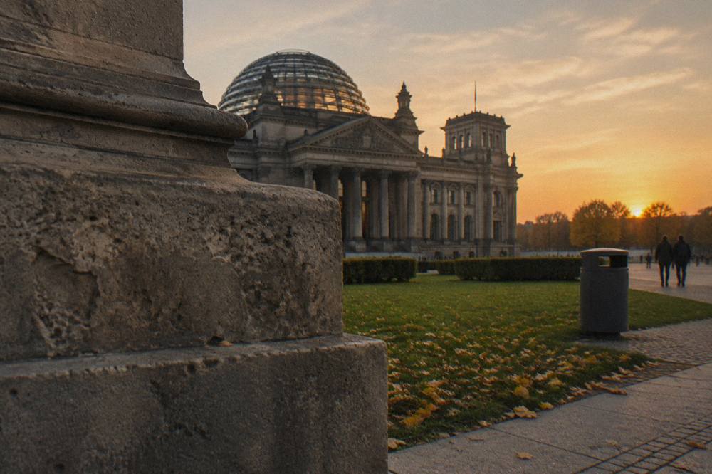 The dome above the Reichstag building seen from the surrounding lawn