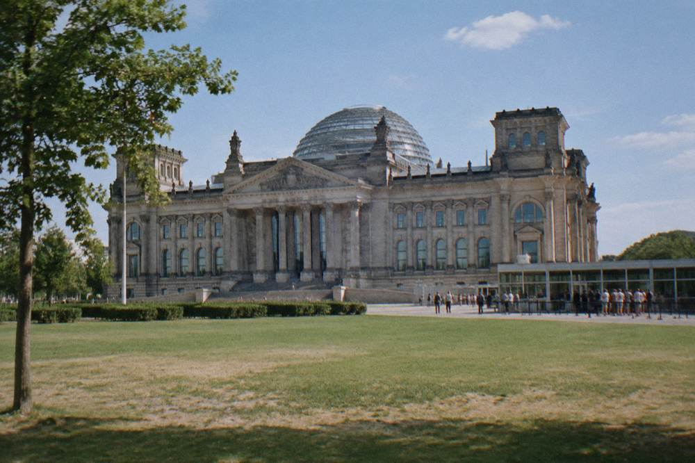 The plaza in front of the Reichstag building on a clear afternoon