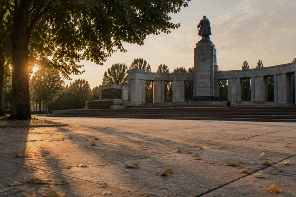 Stone columns of the Soviet Memorial in Treptower Park rising above a wide empty plaza