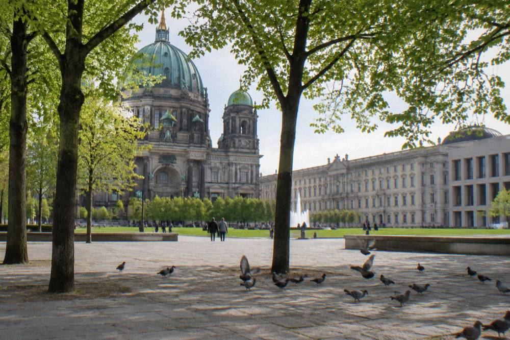 The Lustgarten square in front of Berlin Cathedral with the Humboldt Forum building behind the trees