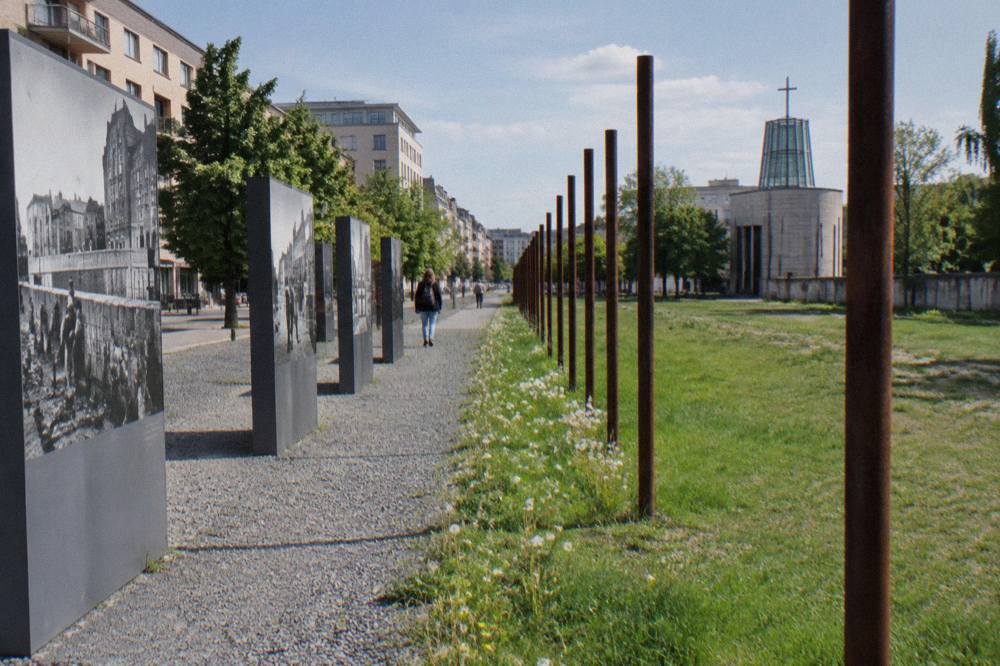 Open-air exhibition panels standing along Bernauer Strasse at the Berlin Wall Memorial