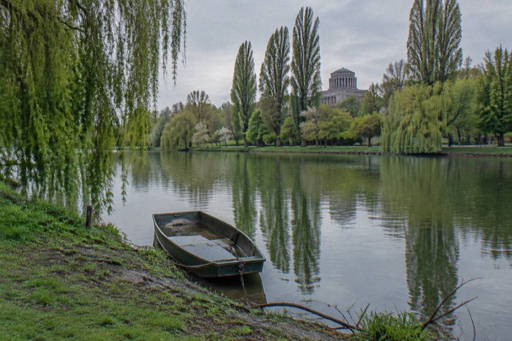 Wide view across a calm Berlin lake with trees along the shore