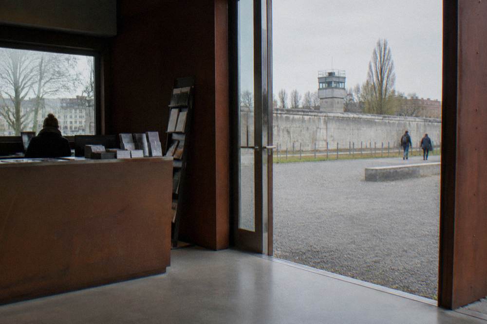 A museum ticket desk and entrance area inside a memorial building