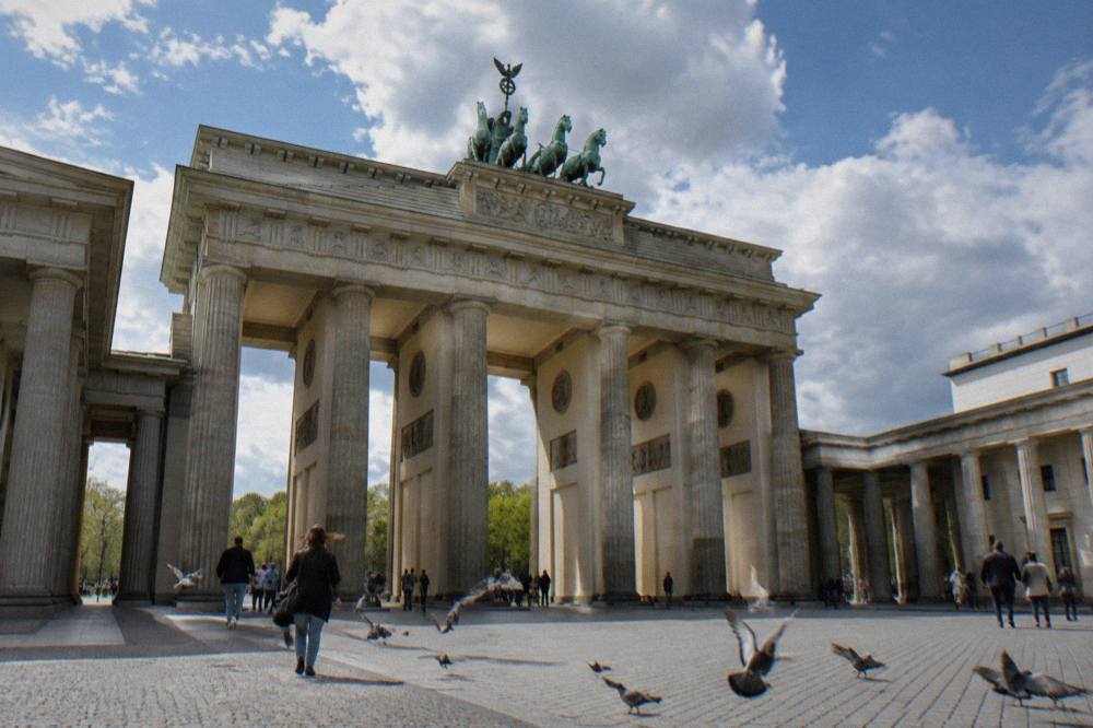 The columns of the Brandenburg Gate seen from street level with the quadriga sculpture on top