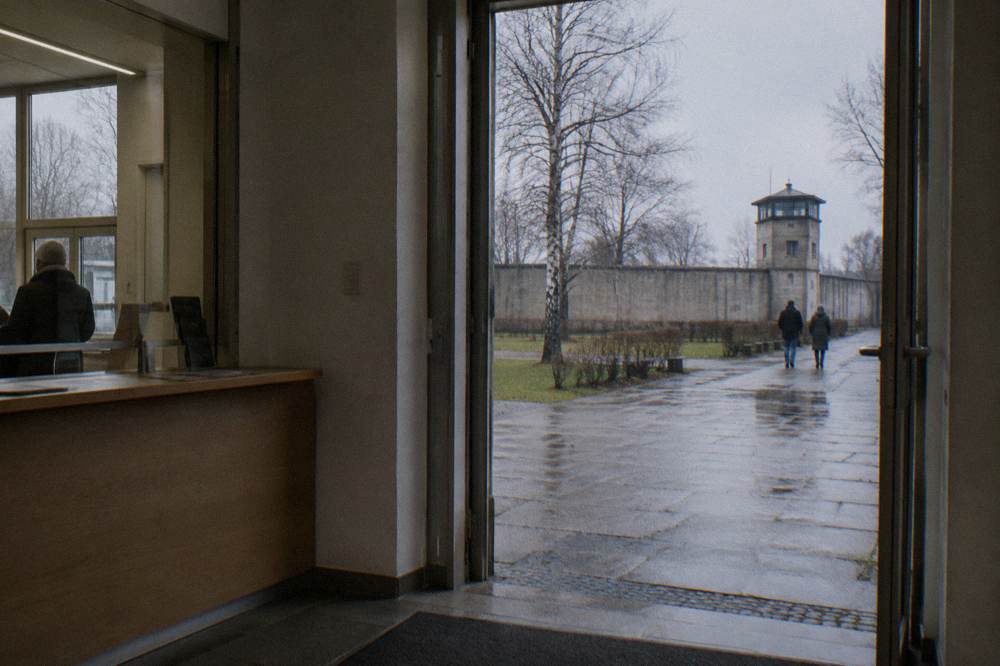 Museum entrance on a Berlin street with a ticket desk visible through the doorway