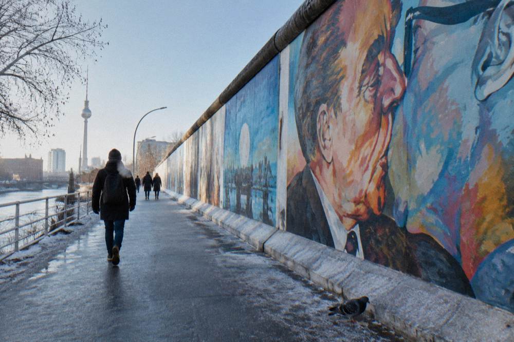 Colourful mural covering a section of concrete wall in daylight