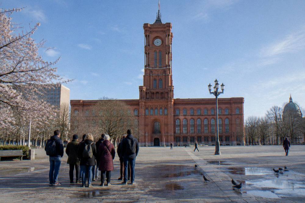 Walking tour group gathered at a Berlin meeting point beside an U-Bahn entrance