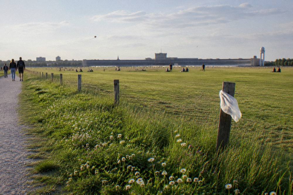Path leading toward open parkland at the edge of the former airfield