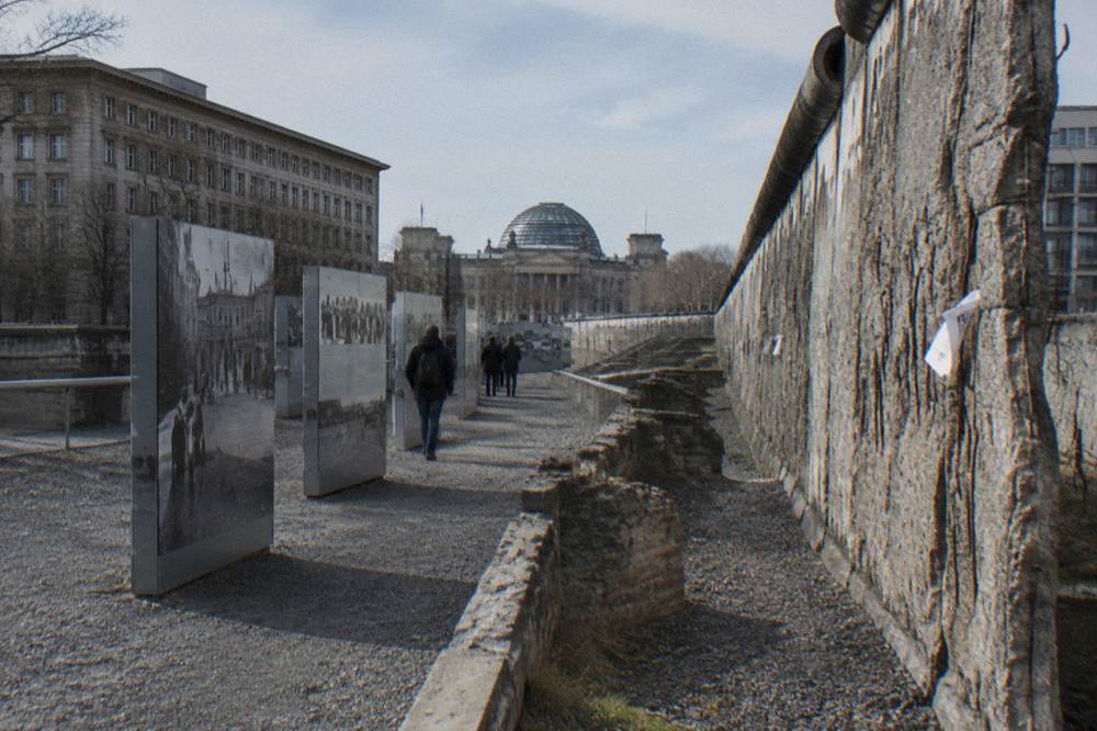 Excavated trench with exhibition panels standing along the walkway