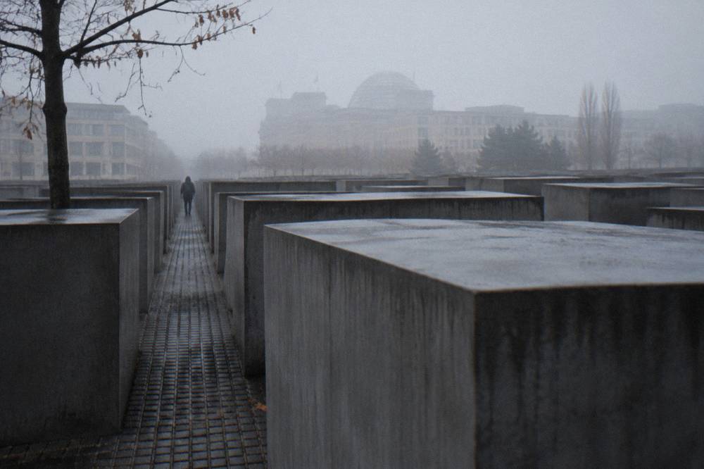 Rows of concrete stelae of the memorial field seen from ground level